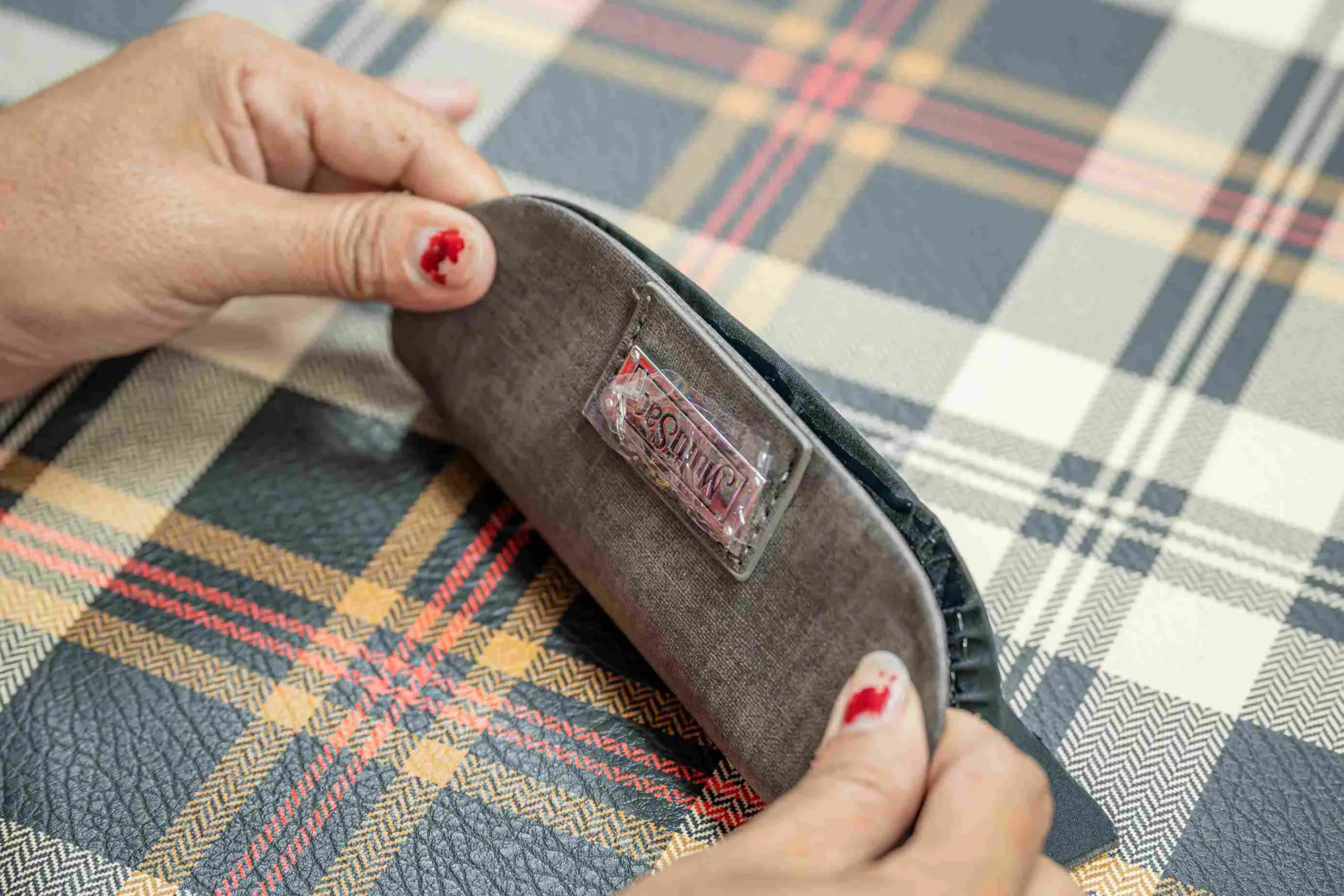Apply protective film to handbag hardware
